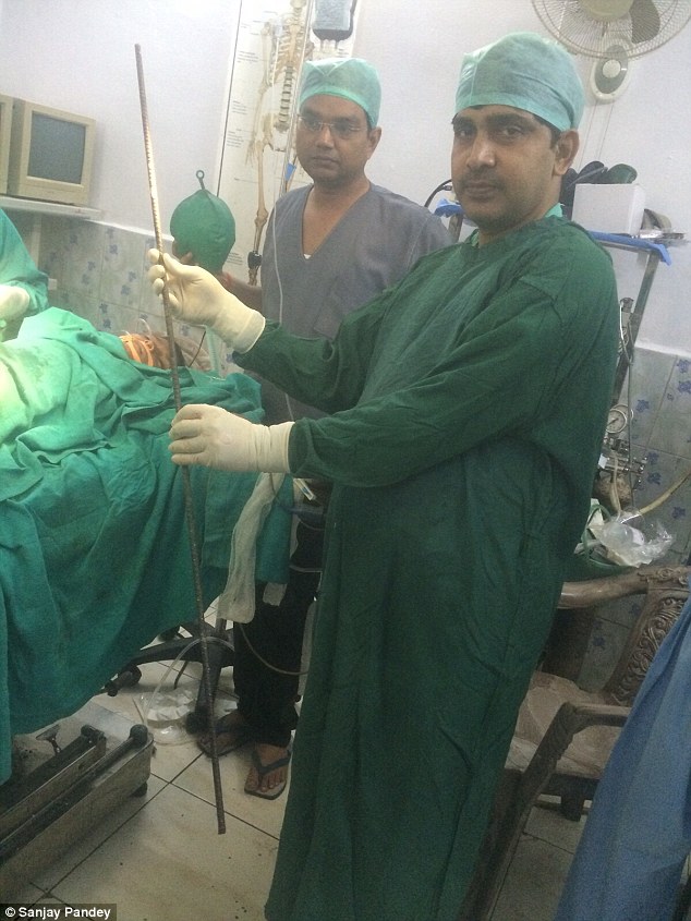 Lifesaver: Dr Rajeev Singh (pictured) and a team of six doctors and hospital staff worked for four hours to remove the rod from Aman's body without damaging any blood vessels or organs 