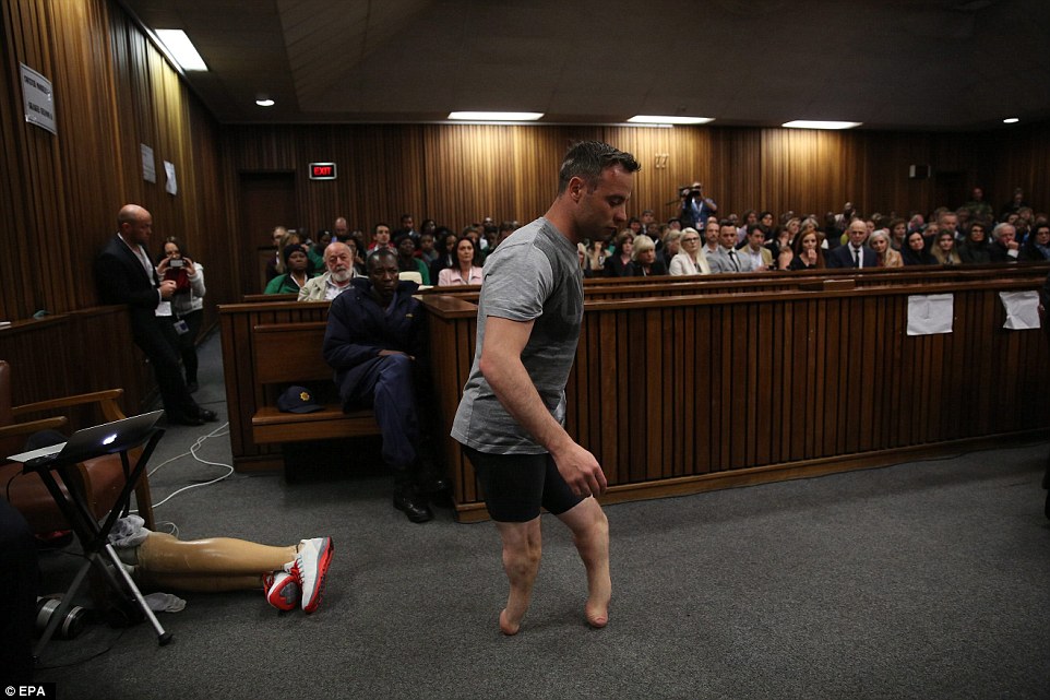 Paralympic gold medalist Oscar Pistorius walks across the packed courtroom on his stumps in a desperate last bid to convince a judge he was too vulnerable to have killed his girlfriend Reeva Steenkamp intentionally when he shot her at his home three years ago